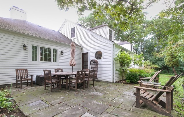 591 Plum Tree Road Barrington Hills, IL 60010 - Photo 19 of 30 a view of a dinning table and chairs in backyard of the house