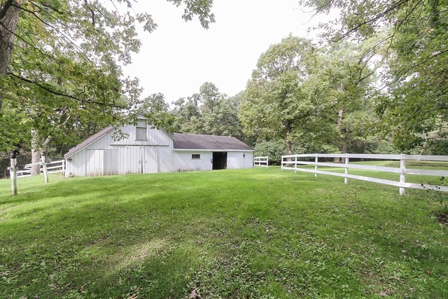 591 Plum Tree Road Barrington Hills, IL 60010 - Photo 24 of 30 a view of a house with a backyard