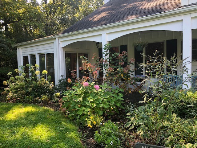 591 Plum Tree Road Barrington Hills, IL 60010 - Photo 26 of 30 a view of a house with potted plants