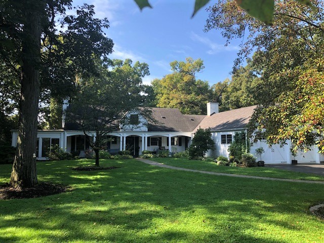 591 Plum Tree Road Barrington Hills, IL 60010 - Photo 27 of 30 a front view of a house with a garden