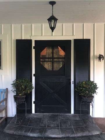 591 Plum Tree Road Barrington Hills, IL 60010 - Photo 4 of 30 a potted plant sitting in front of a door