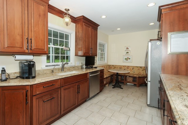 591 Plum Tree Road Barrington Hills, IL 60010 - Photo 9 of 30 a kitchen with granite countertop a sink stove and cabinets