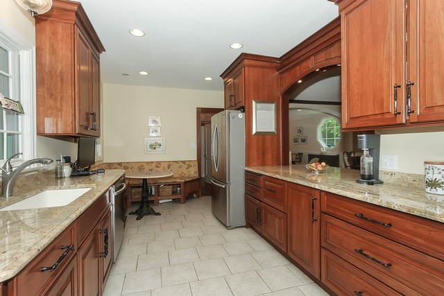 591 Plum Tree Road Barrington Hills, IL 60010 - Photo 10 of 30 a kitchen with granite countertop a sink stainless steel appliances a counter space and cabinets