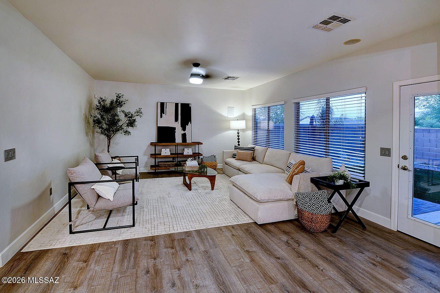 13464 North Piemonte Way Oro Valley, AZ 85755 - Photo 13 of 33 a living room with furniture and wooden floor