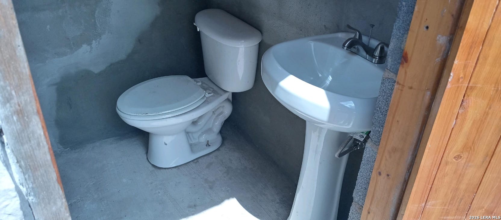 0 County Road 239 Concepcion, TX 78349 - Photo 30 of 38 a white toilet sitting next to a sink