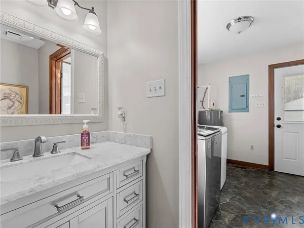 a bathroom with a sink and a mirror