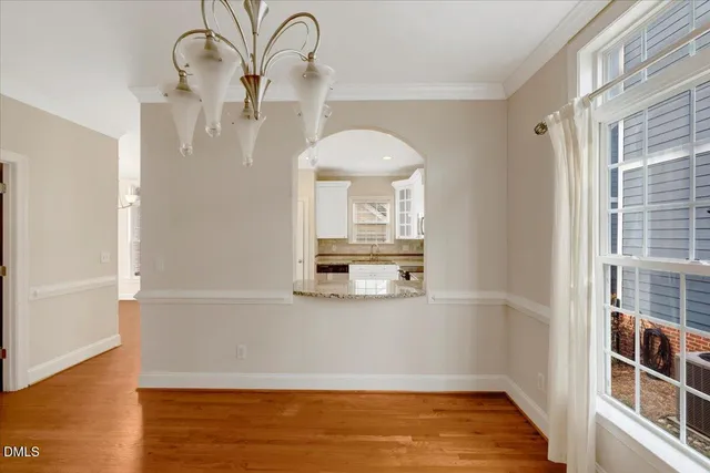 a view of a room with wooden floor and cabinet