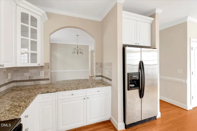 a view of a kitchen cabinets and wooden floor