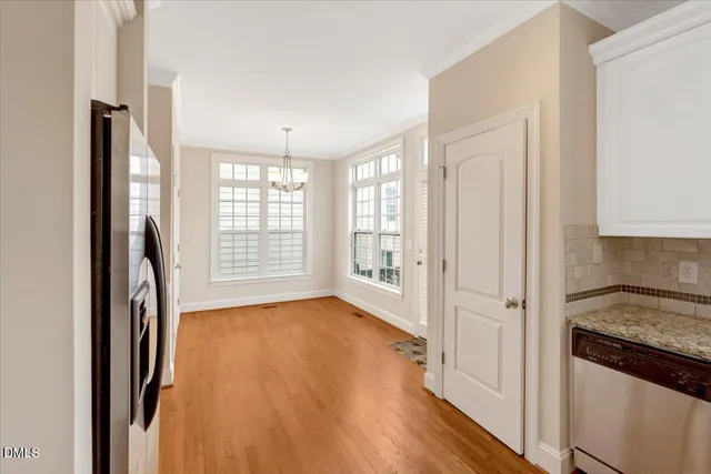 a view of a kitchen with a stove top oven