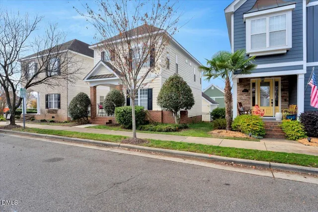a view of a house with a yard and plants