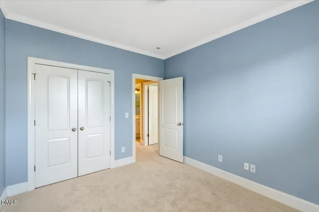 an empty room with closet area