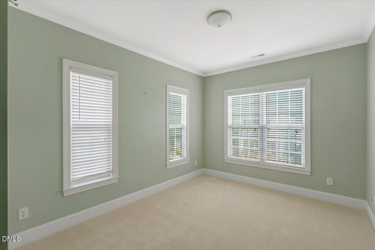 1135 Harp Street Raleigh, NC 27604 - Photo 27 of 36 an empty room with a window