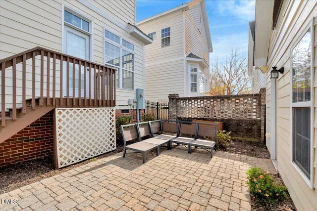 a view of a patio with a table and chairs