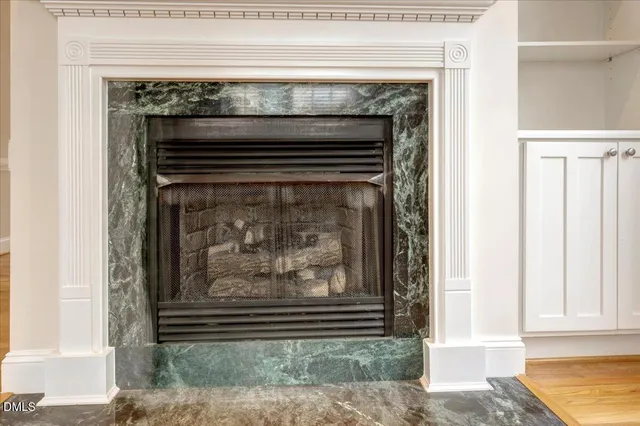 a view of fireplace with wooden floor