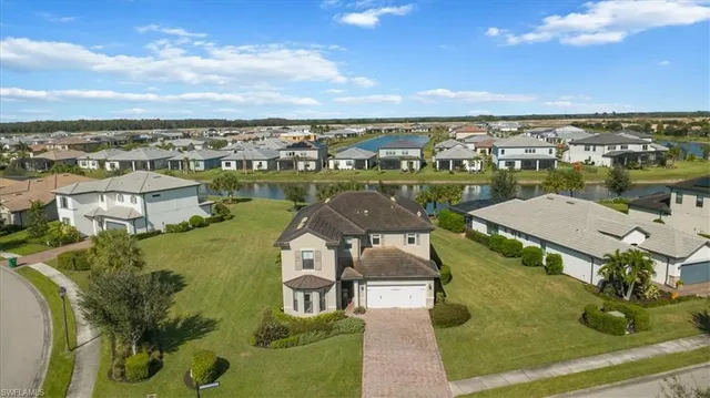 an aerial view of a house with a lake view