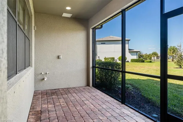 a view of a lake with houses in the back