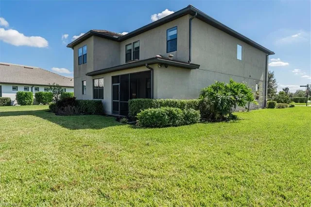 an aerial view of a house with a ocean view