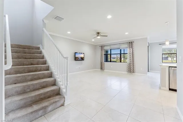 a view of an entryway with wooden floor and a floor to ceiling window