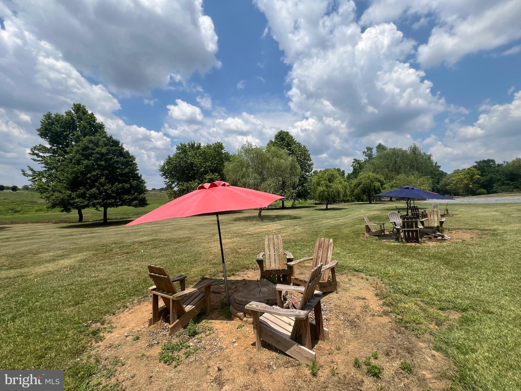 2110 Quicksburg Road Quicksburg, VA 22847 - Photo 29 of 60 an outdoor space with furniture and umbrella