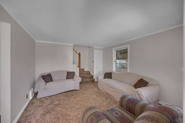 a living room with furniture and a couch