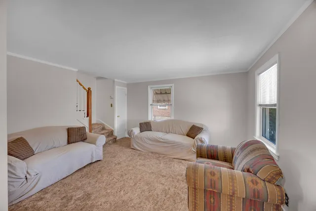 a living room with furniture and a couch