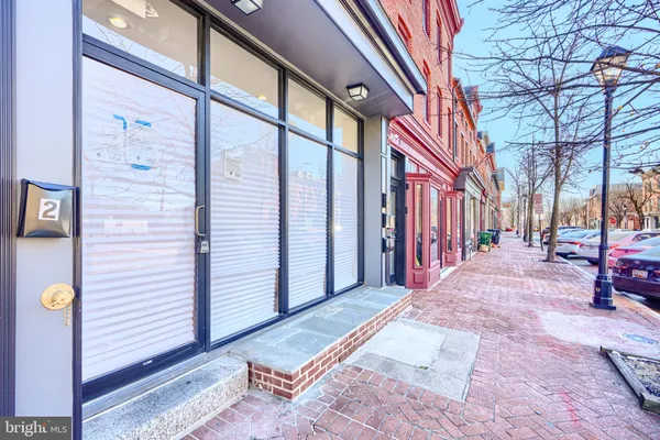 a kitchen with stainless steel appliances granite countertop a refrigerator sink and stove