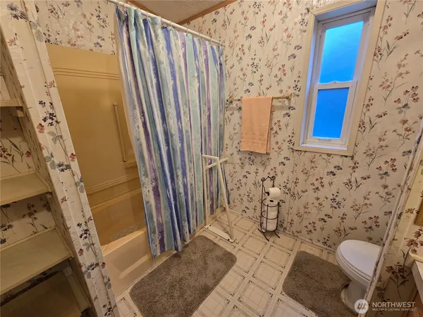 a bathroom with a sink and toilet