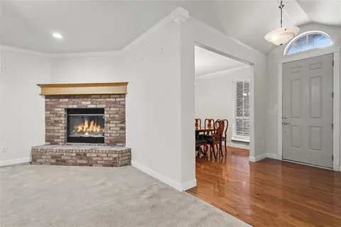 a kitchen with granite countertop a sink a stove and cabinets