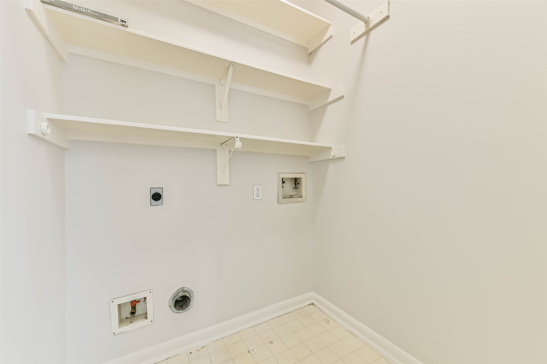 6338 Maple Spring Place Humble, TX 77346 - Photo 41 of 50 Keep everyday chores contained in a dedicated laundry space. Built-in shelves provide a convenient home for detergents and supplies, while the overhead hanging rod offers a place to air-dry clothing or hang freshly pressed pieces.