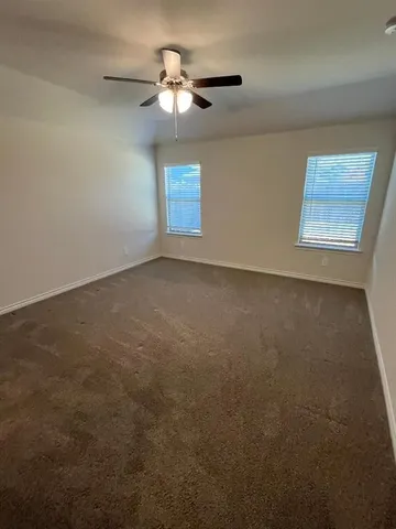 a bathroom with a double vanity sink mirror and shower