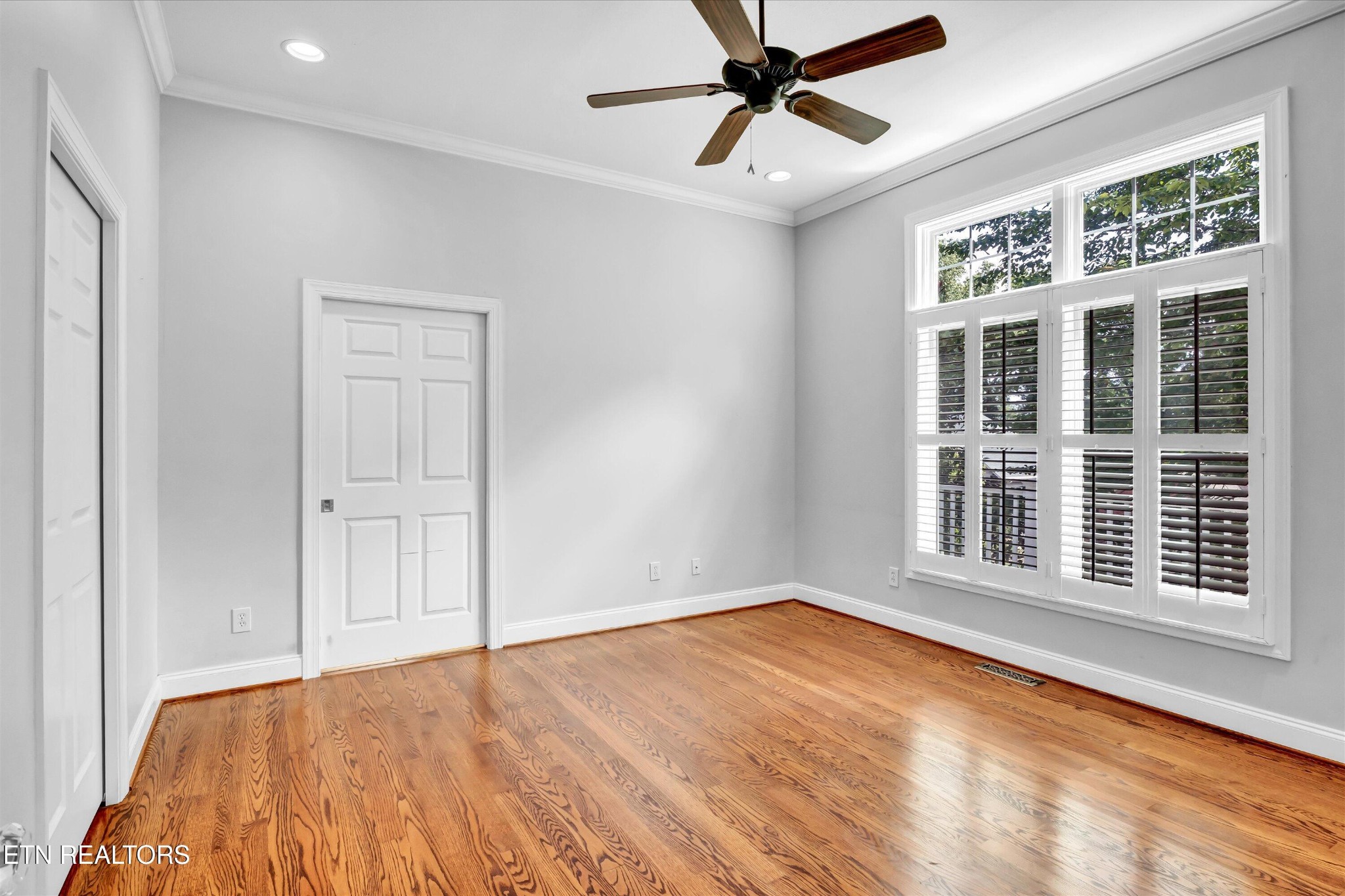 140 Ootsima Way Loudon, TN 37774 - Photo 12 of 31 a view of an empty room with wooden floor and a window