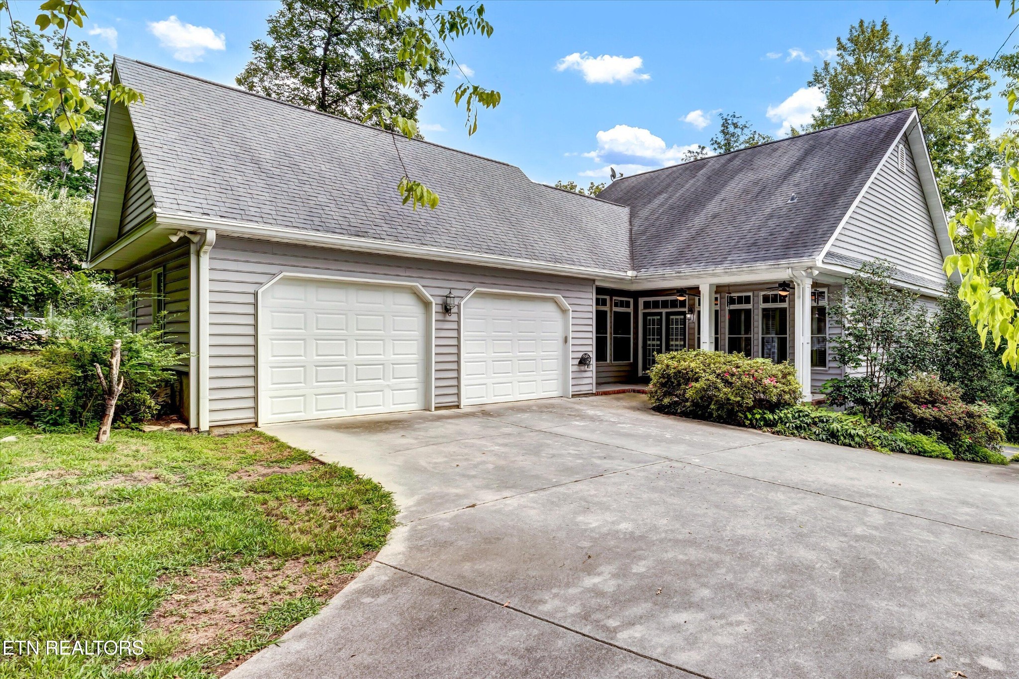 140 Ootsima Way Loudon, TN 37774 - Photo 2 of 31 a view of a house with a yard and potted plants