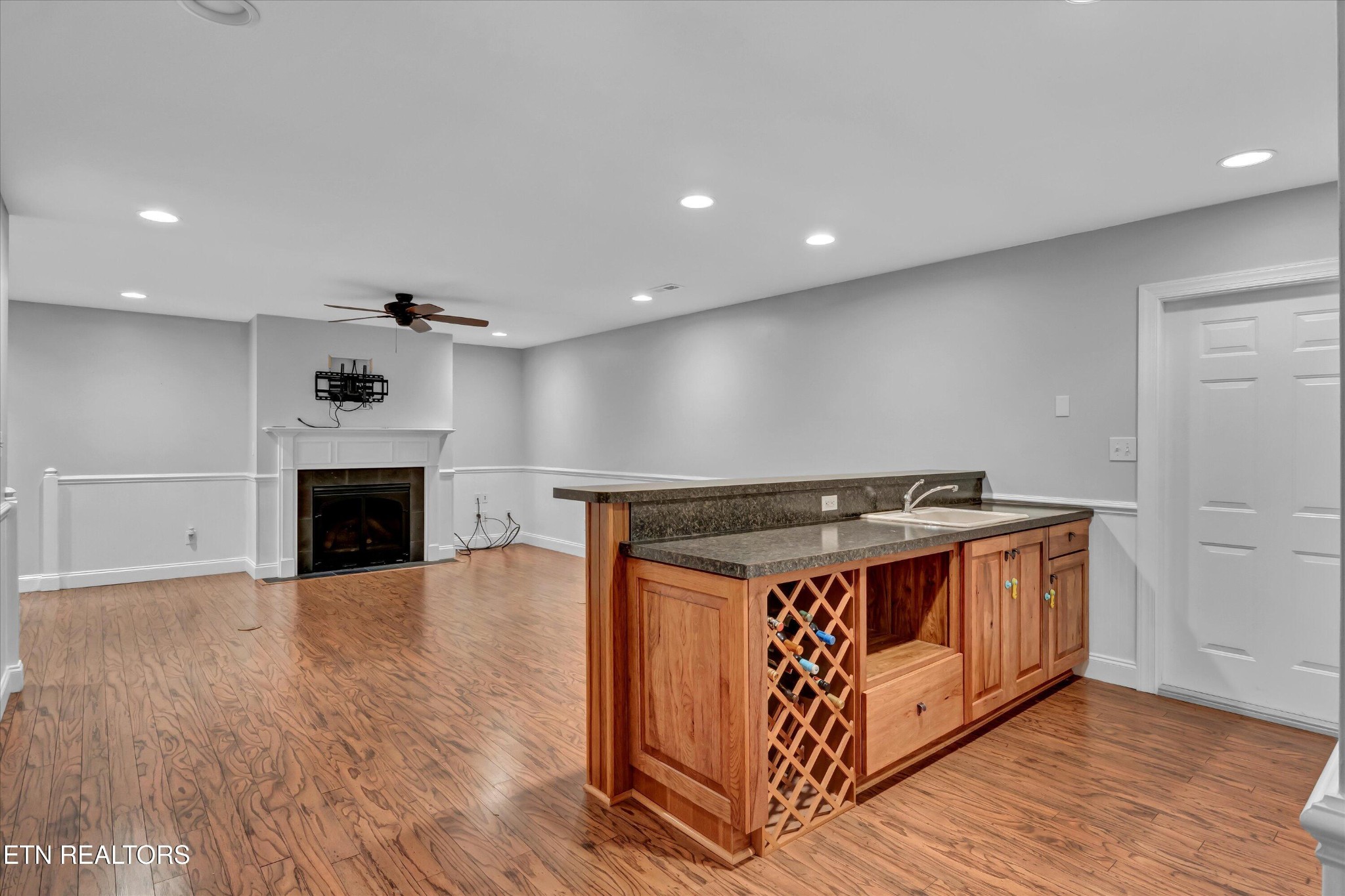 140 Ootsima Way Loudon, TN 37774 - Photo 21 of 31 a view of an empty room with wooden floor a fireplace and entryway
