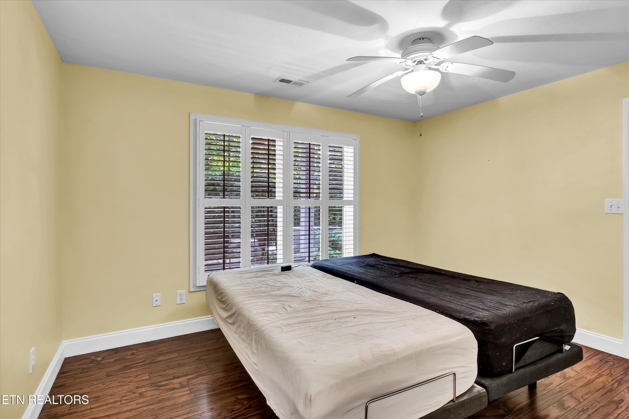 140 Ootsima Way Loudon, TN 37774 - Photo 26 of 31 a bedroom with a bed and a chandelier