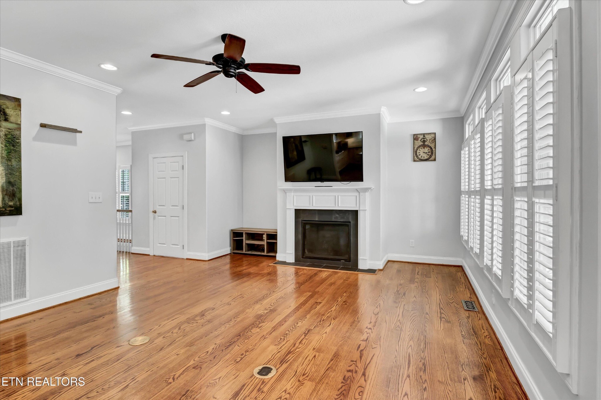 140 Ootsima Way Loudon, TN 37774 - Photo 4 of 31 a view of empty room with wooden floor and fireplace