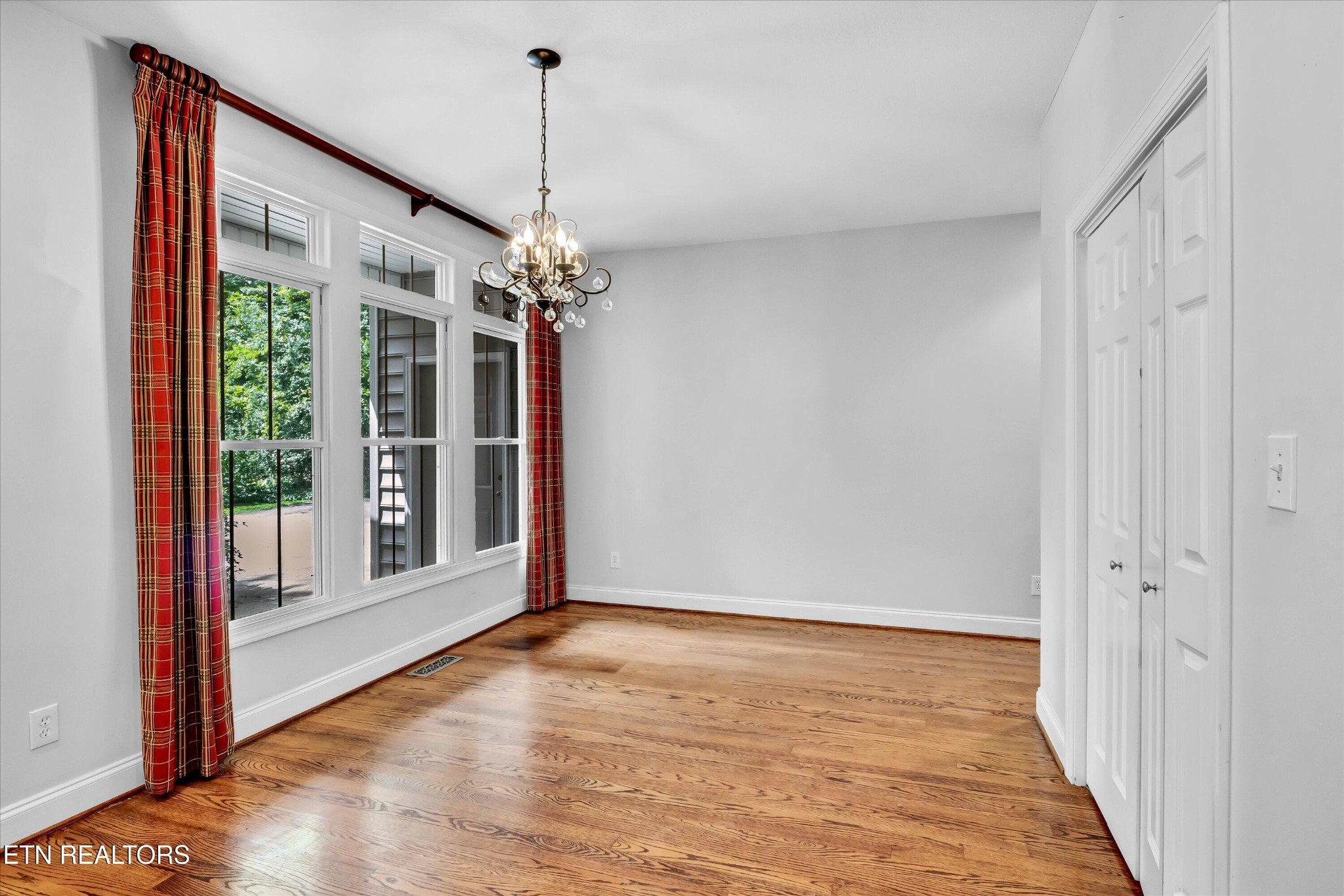 140 Ootsima Way Loudon, TN 37774 - Photo 9 of 31 a view of a room with wooden floor fireplace and windows