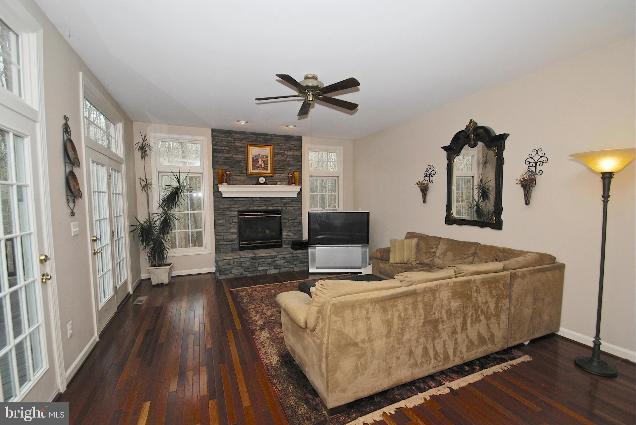 201 Ladybug Way Edgewater, MD 21037 - Photo 11 of 30 Family Room off kitchen with stone gas fireplace