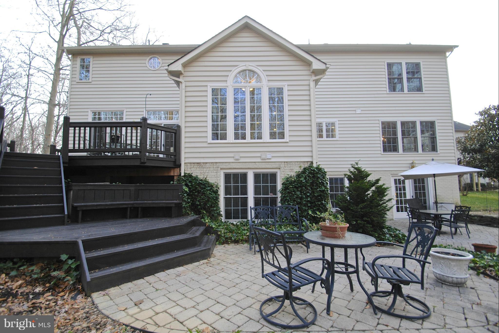 201 Ladybug Way Edgewater, MD 21037 - Photo 6 of 30 Tiered decking and paver patio in backyard
