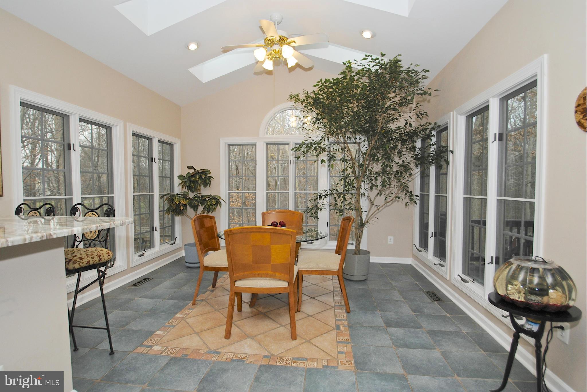 201 Ladybug Way Edgewater, MD 21037 - Photo 9 of 30 Vaulted ceilings in sunroom - opens to deck