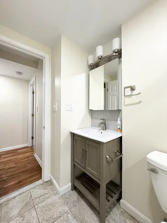 a bathroom with a sink and mirror