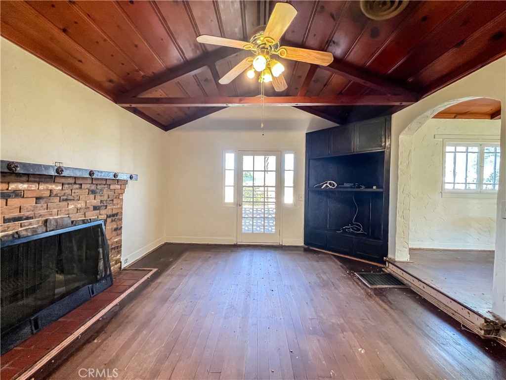 506 Desnok Street Needles, CA 92363 - Photo 13 of 70 an empty room with windows and fireplace