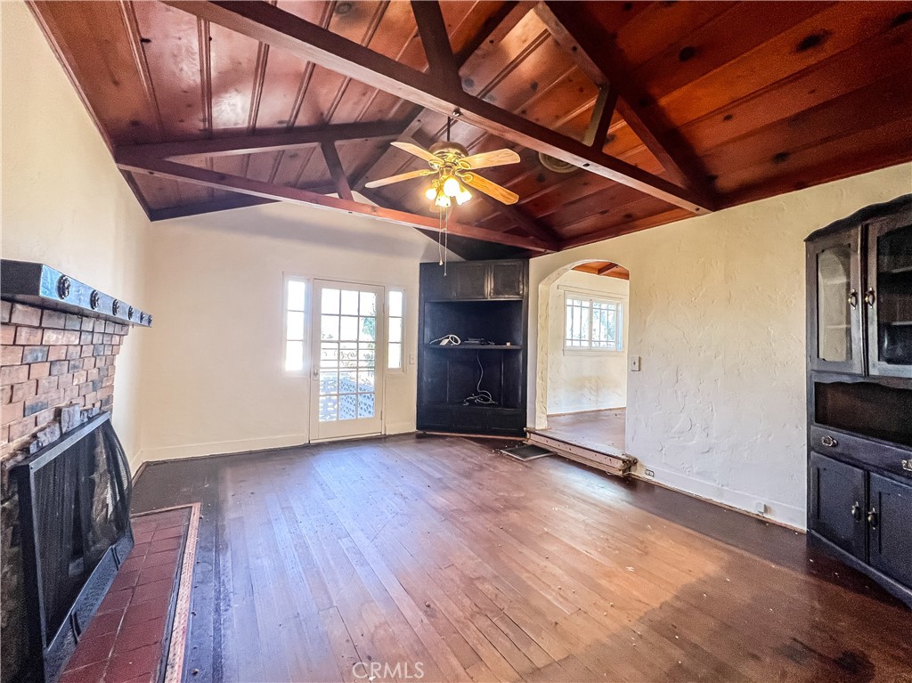 506 Desnok Street Needles, CA 92363 - Photo 15 of 70 a view of empty room with wooden floor and fan