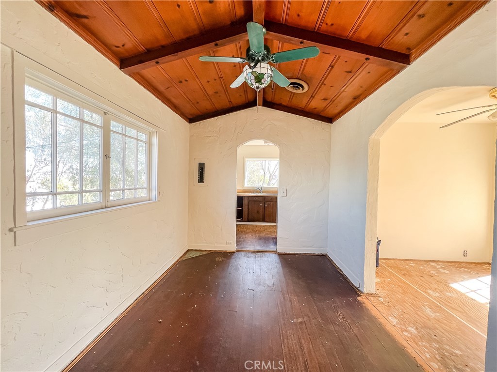 506 Desnok Street Needles, CA 92363 - Photo 16 of 70 a view of a hallway with wooden floor and a kitchen