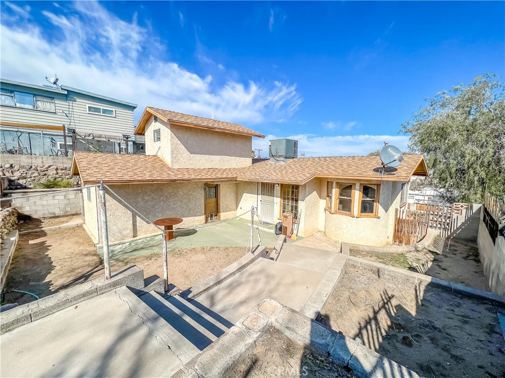 506 Desnok Street Needles, CA 92363 - Photo 2 of 70 a front view of a house with a yard
