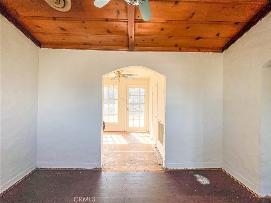 506 Desnok Street Needles, CA 92363 - Photo 22 of 70 a view of a room with wooden floor and windows