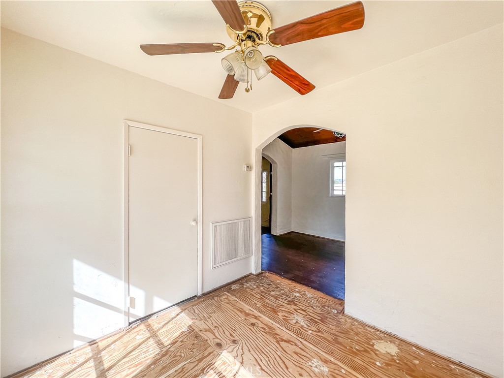 506 Desnok Street Needles, CA 92363 - Photo 28 of 70 a view of a hallway with a chandelier fan