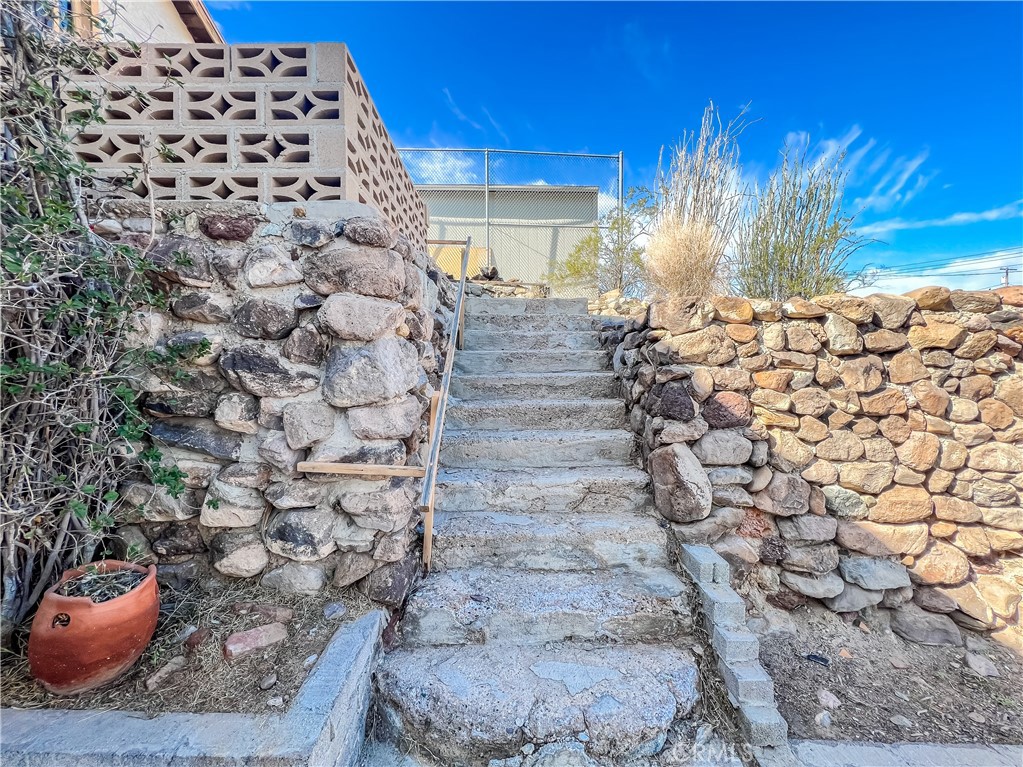 506 Desnok Street Needles, CA 92363 - Photo 3 of 70 a view of a fireplace with wooden floor