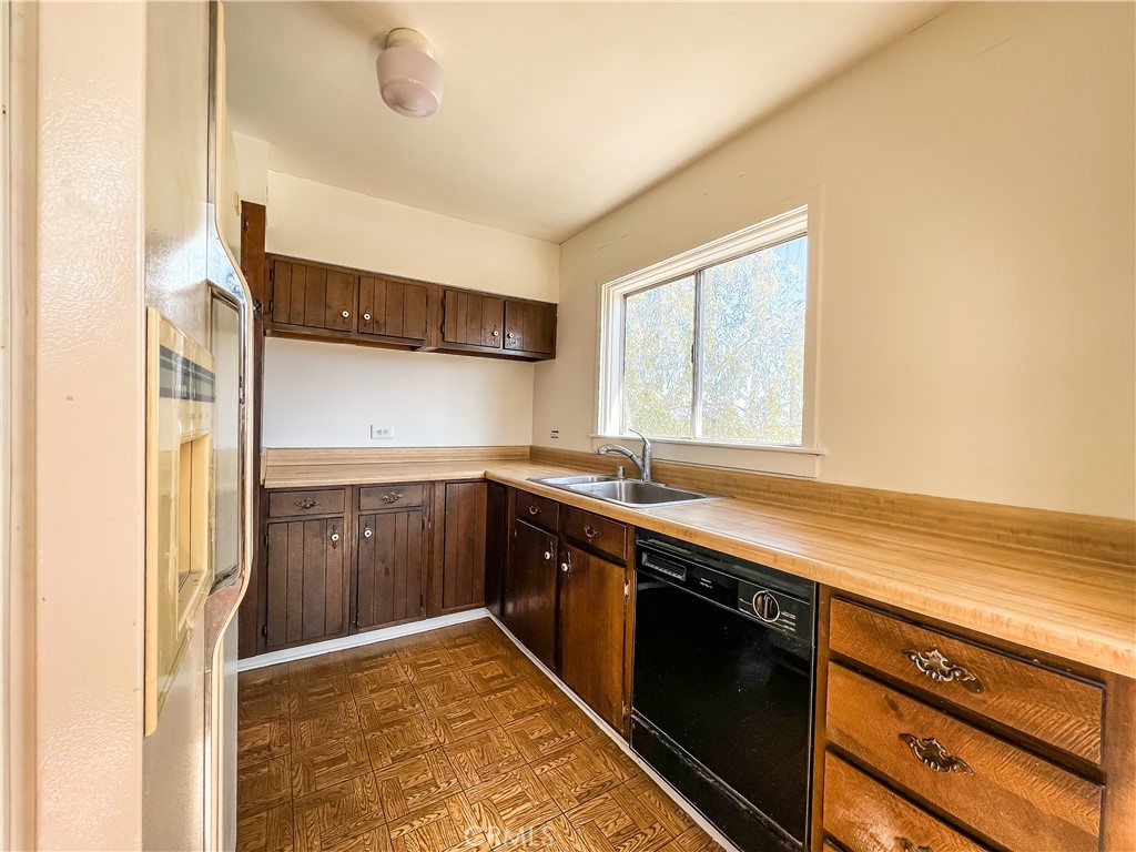 506 Desnok Street Needles, CA 92363 - Photo 36 of 70 a kitchen with stainless steel appliances granite countertop a sink stove and refrigerator
