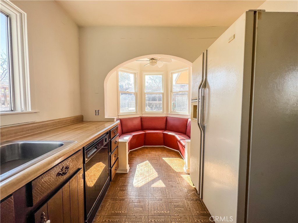 506 Desnok Street Needles, CA 92363 - Photo 37 of 70 a living room with a couch and a sink