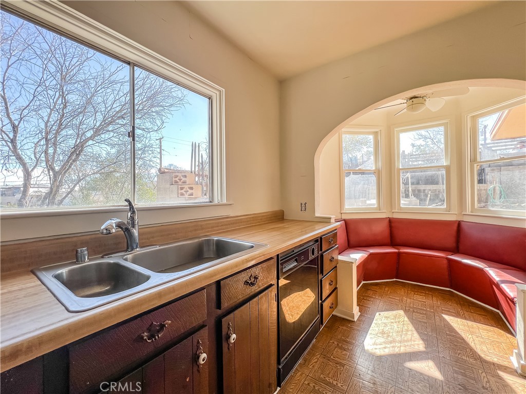 506 Desnok Street Needles, CA 92363 - Photo 38 of 70 a kitchen with a sink and large windows